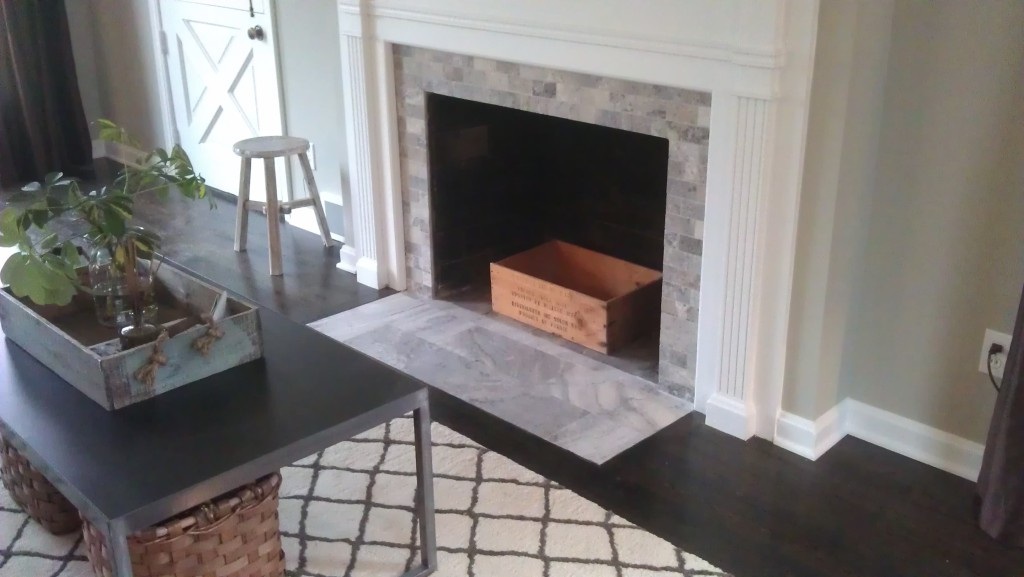 grey travertine tile fireplace
